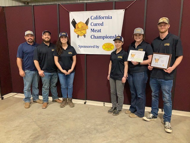 (From left to right): Caleb Sehnert, Jarrod Cerniglia, Indiana Rivera-Grundberg, Emrys Yang, Grazia Machado & Duncan Creed at the California Association of Meat Processors annual convention and cured meat show