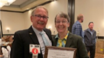 Dr. Bradley receives the “Good Egg” award. With Committee Member, Jeff Meyer.