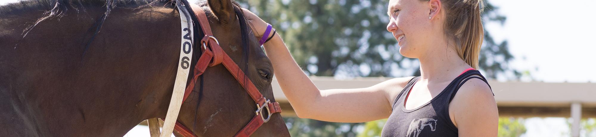student with horse